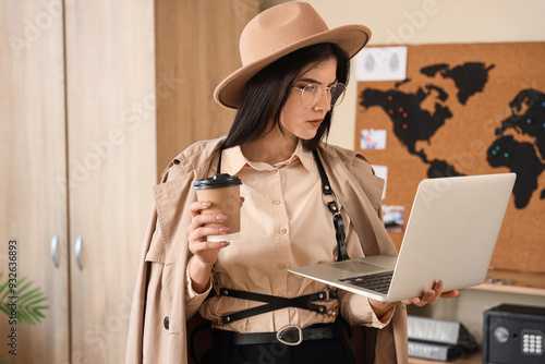 Female spy with laptop and ...
