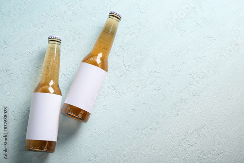 Bottles of cold beer on lig...