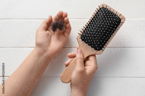 Hands holding brush and clu...