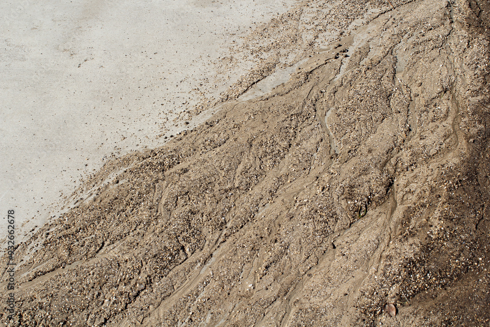 Dirt mud washed up on a concrete surface Dirt mud washed up on a concrete surface