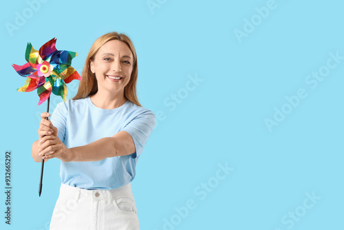 Mature woman with toy windm...