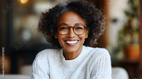 A smiling woman with curly ...