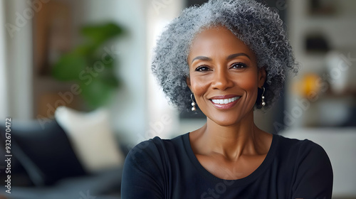 A smiling woman with gray h...