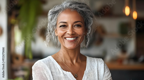 A smiling woman with gray h...
