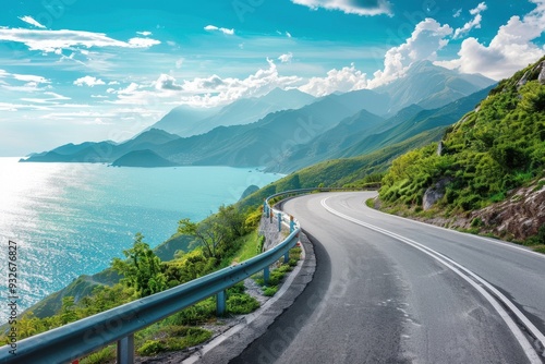 Mountain road with blue sky and sea in background