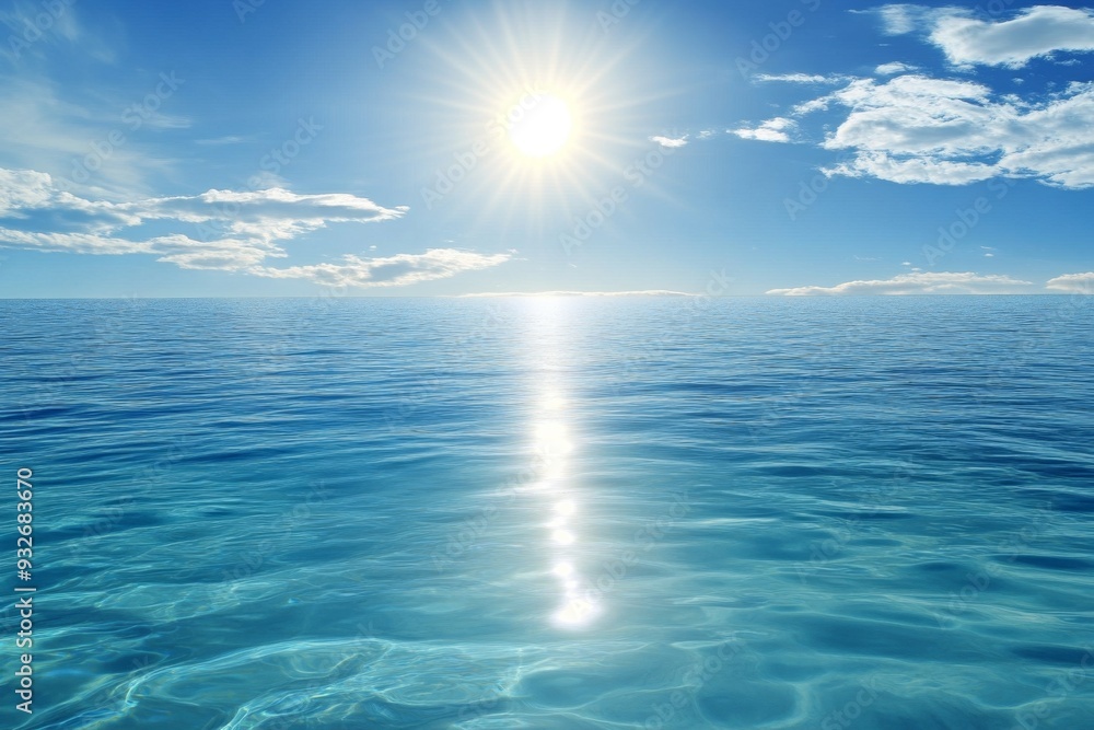 Fototapeta premium Serene Ocean with Clear Blue Waters and Bright Sunlight, Reflecting Light on the Horizon with Scattered White Clouds