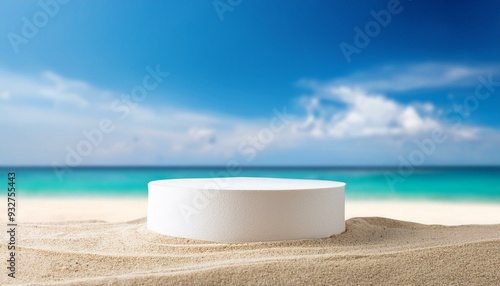 White stone podium with copy space for product display on tropical summer sand beach background