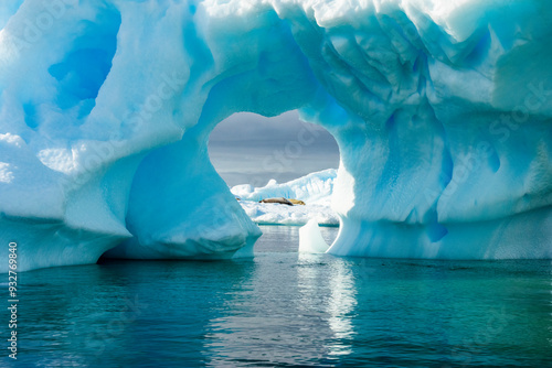 French Passage, Antarctica. Looking through a hole in an iceberg in the waters of the French Passage. photo