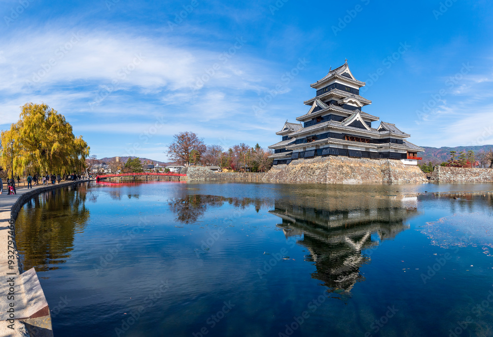 A sweeping view of Matsumoto Castle with its reflection in the moat, Japan A sweeping view of Matsumoto Castle with its reflection in the moat, Japan