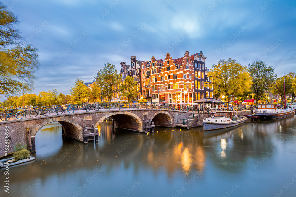 Autumn in Amsterdam, Netherlands. Panorama of the historic city center of Amsterdam. Traditional houses and bridges of Amsterdam small town. Europe, Netherlands, Holland, Amsterdam.