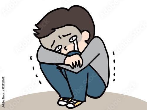 辛くてうずくまって泣く人