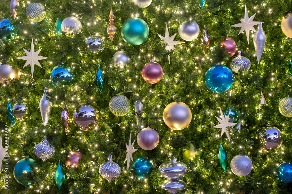 Christmas ornaments and lights on an artificial tree Christmas ornaments and lights on an artificial tree