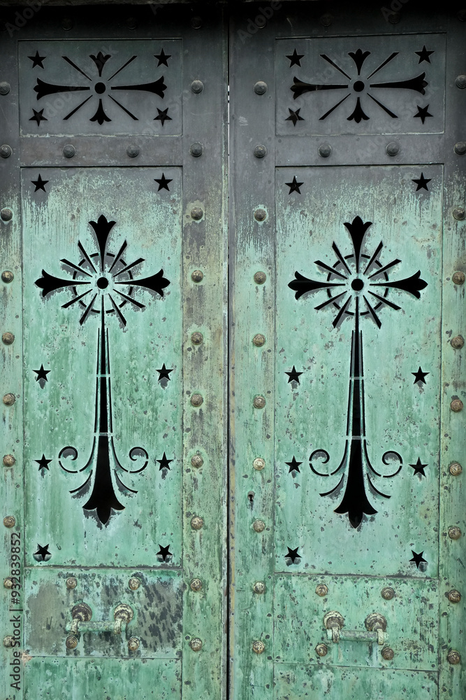 Paris, France. The famous Pere LaChaise Cemetery beautiful old metal work on door. Paris, France. The famous Pere LaChaise Cemetery beautiful old metal work on door.