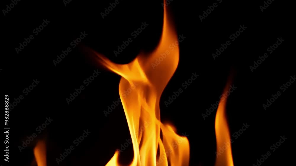 Flames moving slowly in a rhythmic pattern on a black background Flames moving slowly in a rhythmic pattern on a black background
