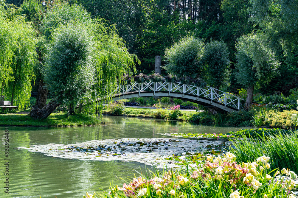 Scenic pond with bridge to island in Kumla Sweden Scenic pond with bridge to island in Kumla Sweden
