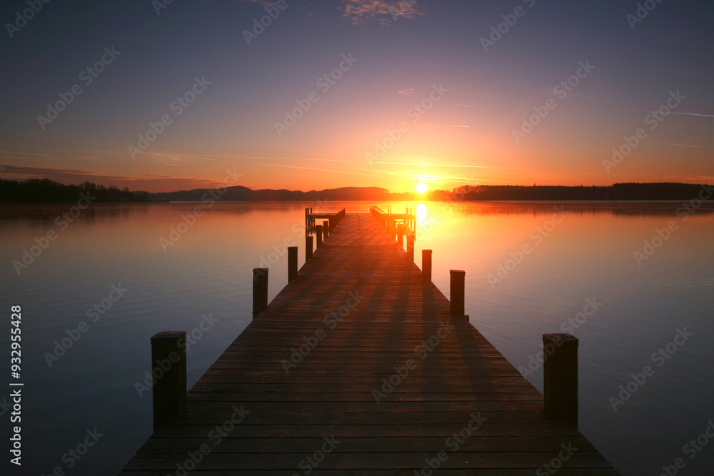 Fototapeta premium a wooden jetty in romantic sunset light