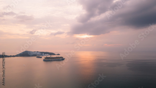 Aerial view, drone flying over Phuket city, Thailand. Drone over Patong Beach on Sunday in Phuket and tourists shopping at a street full of local merchants selling food, people resting by the sea.