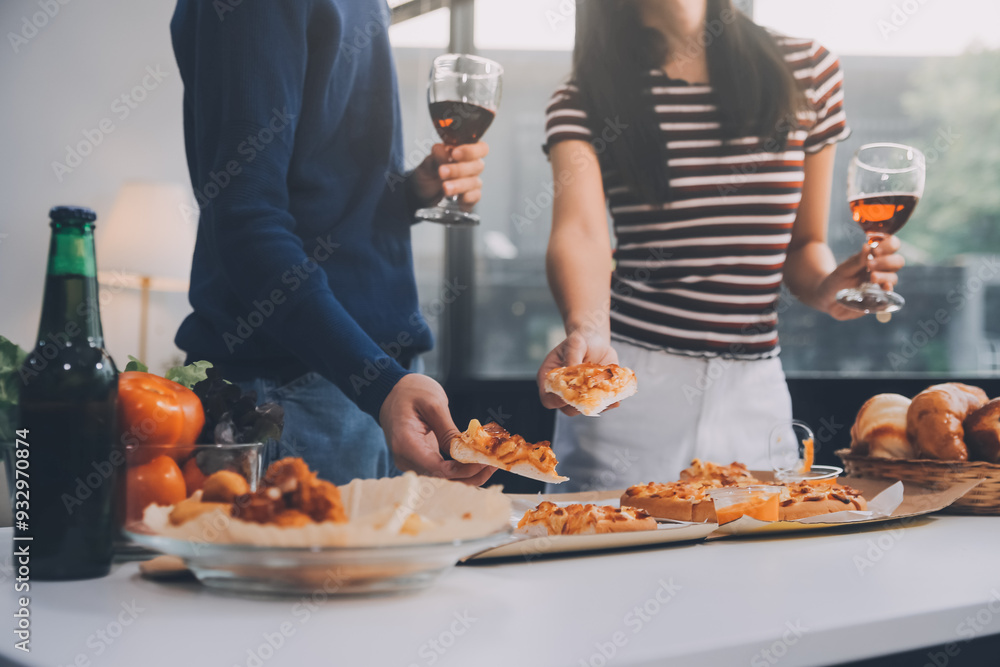 Group of young friends eating pizza.Home party. Group of young friends eating pizza.Home party.
