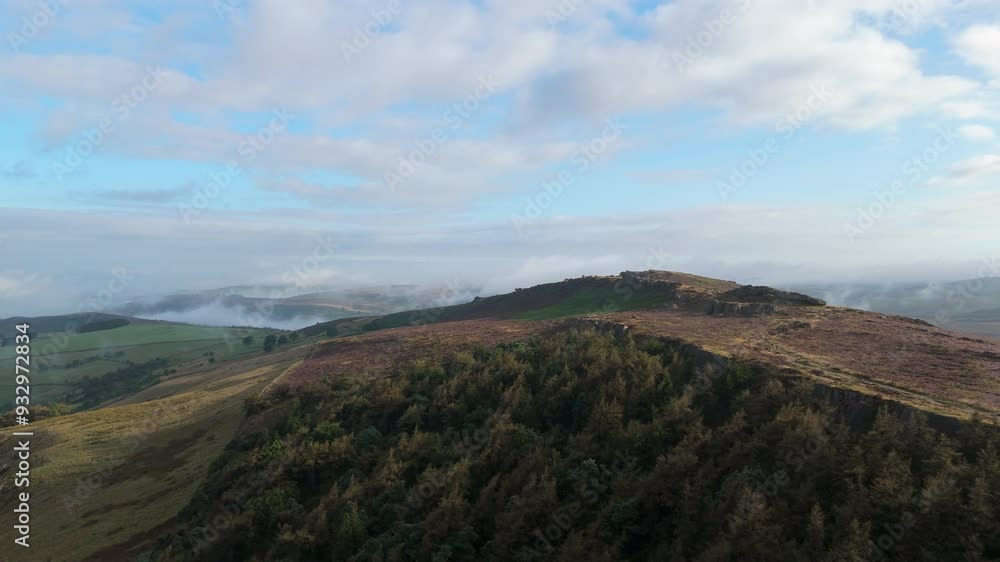 Early morning aerial perspective of mist, fog, and purple heather in bloom from the Peak District National Park, England, UK. Early morning aerial perspective of mist, fog, and purple heather in bloom from the Peak District National Park, England, UK.