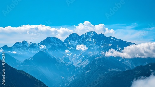 A scenic view of a mountain range under a clear blue sky. 