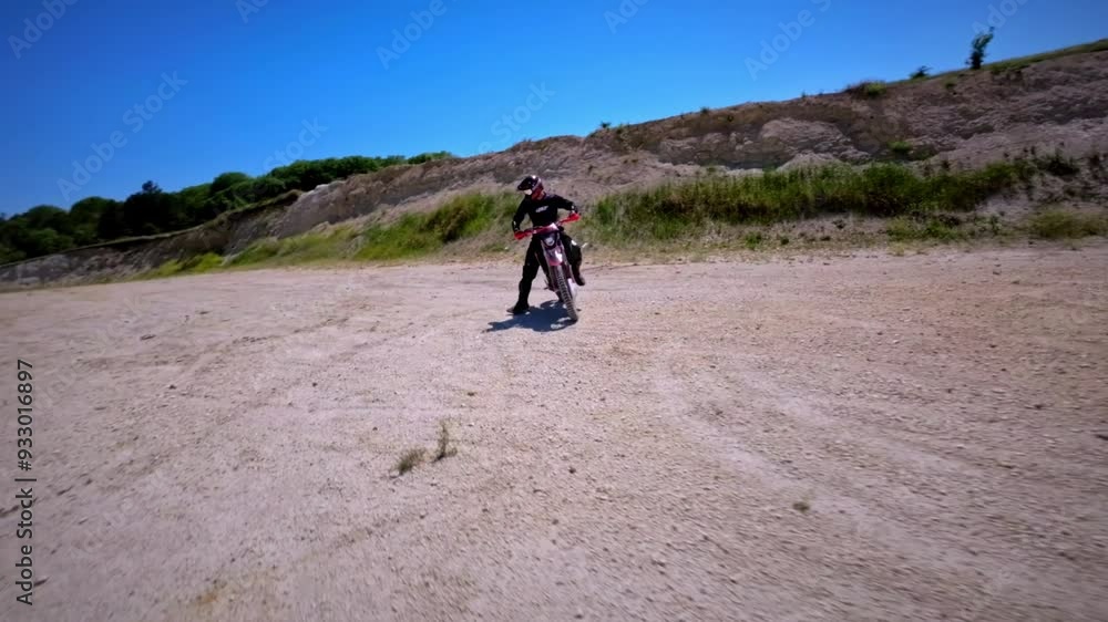 An enduro racer rides a cross-country bike with tricks at his home spot. Speedrump. FPV shot from drone motorcycle cross extreme sport adventure. Filmed on a sports FPV drone quadcopter An enduro racer rides a cross-country bike with tricks at his home spot. Speedrump. FPV shot from drone motorcycle cross extreme sport adventure. Filmed on a sports FPV drone quadcopter