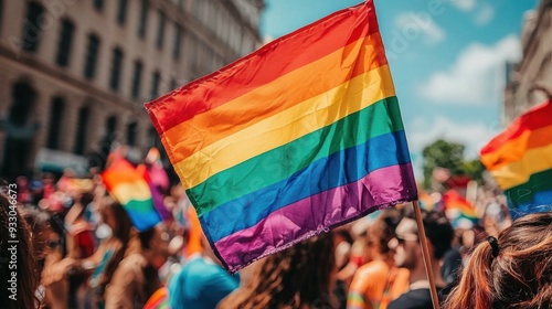 Pride Flag Soars Above a Blurry Sea of Celebration