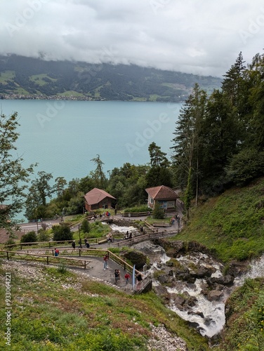 Swiss village waterfall above a lake