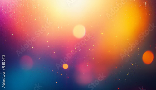 Abstract background with blurred lights and bokeh effect in shades of blue, purple, orange, and yellow.