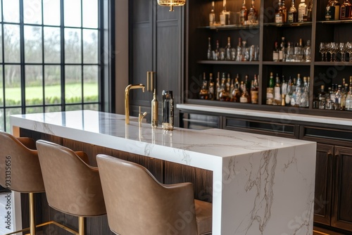 Elegant home bar featuring a marble countertop, leather bar stools, and an extensive liquor display against a dark backdrop