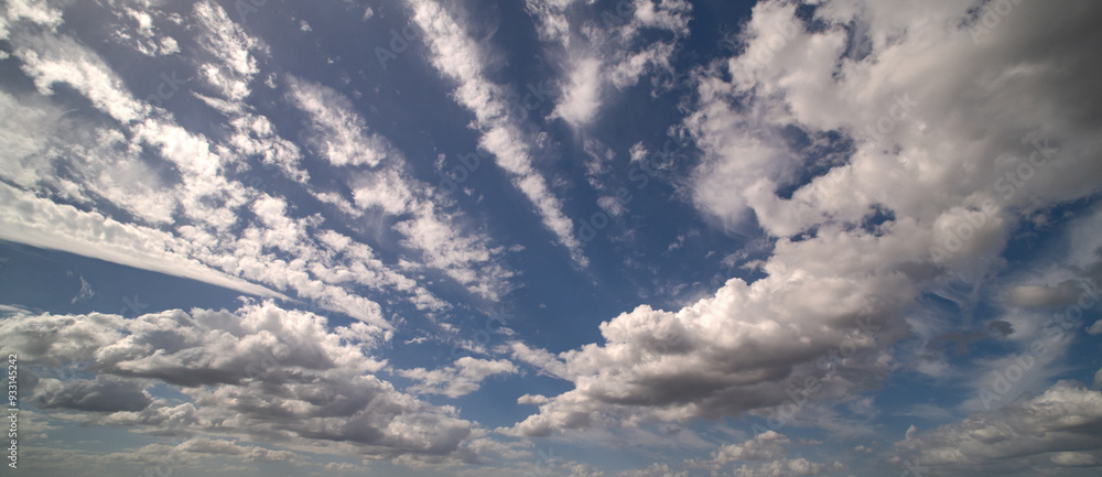 Fototapeta premium Cloud on blue sky. Pastel soft fluffy clouds with empty space. Beauty placement present promotion, summer paradise dreamy concept. Real sky background with gentle clouds. Poster with Clouds.