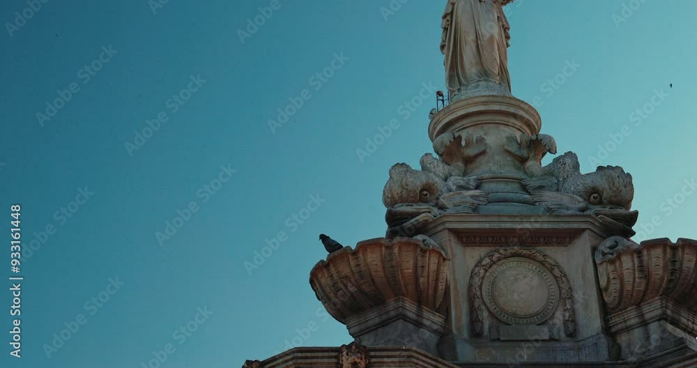 Mumbai, India. Pigeon Sits On Flora Fountain, Close-up view. Slow Motion Fly Of Pigeons Above Flora Fountain. Fountain Located At Hutatma Chowk Is Ornamentally Sculpted Architectural Heritage Monument Mumbai, India. Pigeon Sits On Flora Fountain, Close-up view. Slow Motion Fly Of Pigeons Above Flora Fountain. Fountain Located At Hutatma Chowk Is Ornamentally Sculpted Architectural Heritage Monument