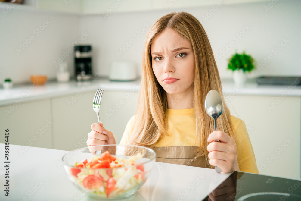 Photo of cute adorable girl eating supper plate organic vegetable salad healthy food indoors house kitchen Photo of cute adorable girl eating supper plate organic vegetable salad healthy food indoors house kitchen