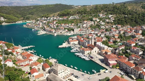 Aerial Drone Footage of Pucisca Village on Brac Island Showcasing Coastal Beauty and Historic White Stone Architecture