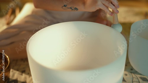 Woman is Practicing with Meditation Bowls