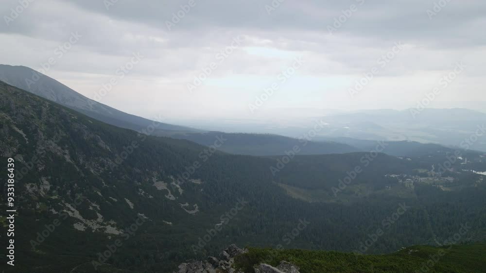 Flying from the edge of a mountain to the valley in Tatras National Park Slovakia, aerial cinematic drone footage Flying from the edge of a mountain to the valley in Tatras National Park Slovakia, aerial cinematic drone footage