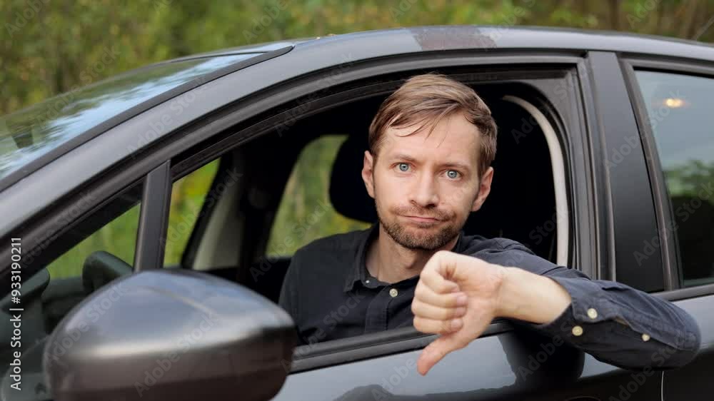 Sad driver showing thumbs down in car. Bad customer service by repair shop. Sad driver showing thumbs down in car. Bad customer service by repair shop.