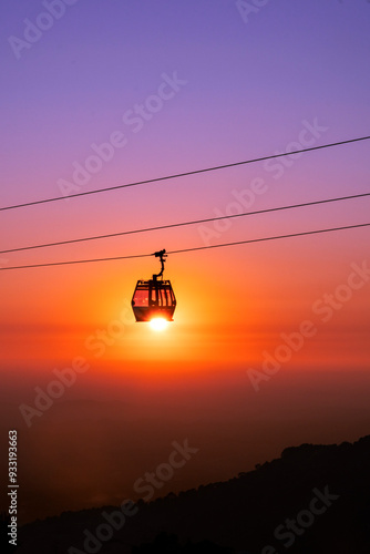 cable car gliding through the sunset. photo