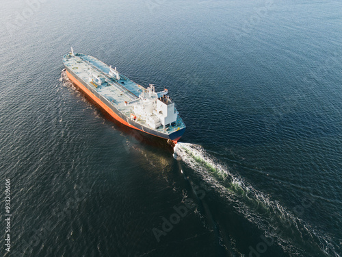 A large gas tanker sails in the Baltic Sea, photo view from above.