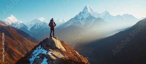 climbers reaching the top of a rocky mountain at sunset, achivement concept, perfect as background or wallpaper.