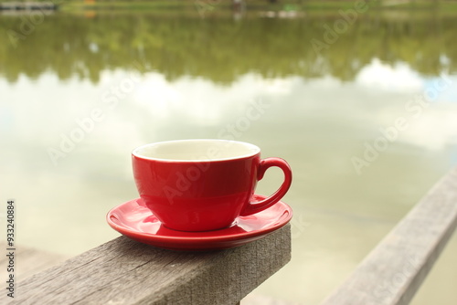 Wallpaper Mural A man is drinking coffee in red cup color Torontodigital.ca