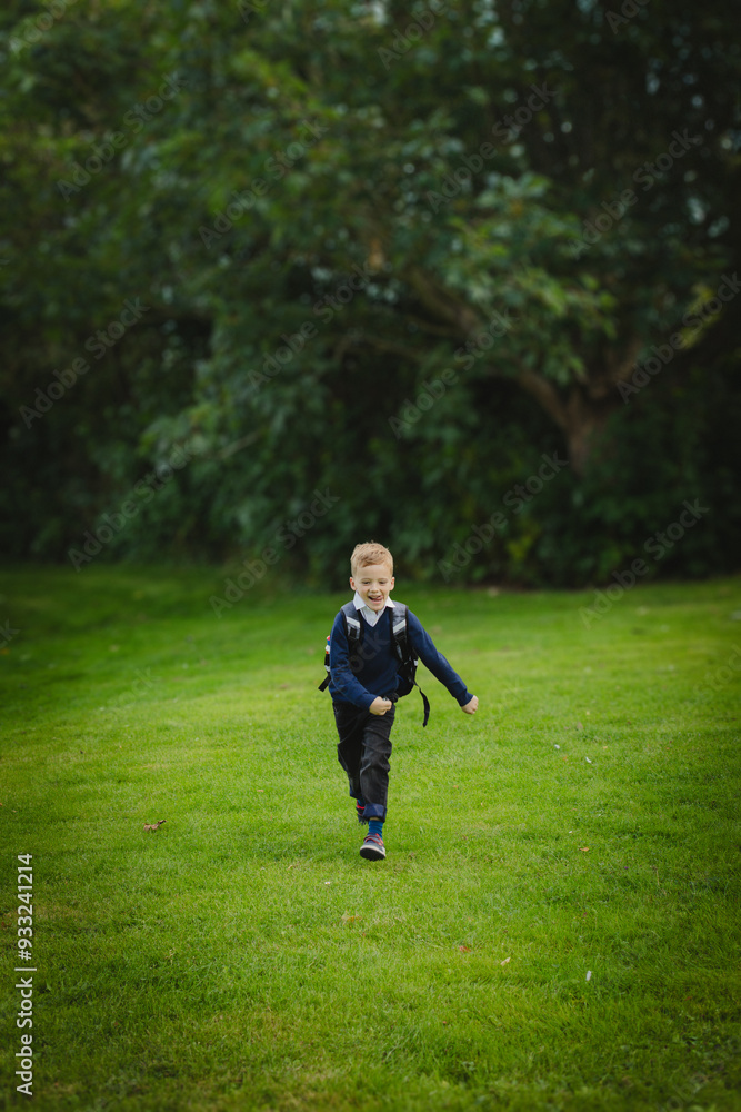 Full length of boy walking on grassy field Full length of boy walking on grassy field