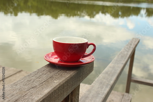 Wallpaper Mural A man is drinking coffee in red cup color Torontodigital.ca