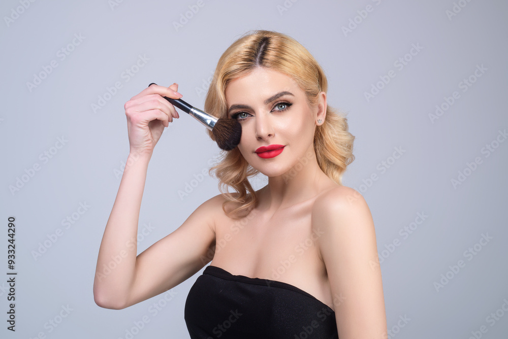 Beauty girl with makeup brushes. Make up for woman. Girl with makeup brushes near face. Cosmetic brush. Facial Makeup. Female model applying blush powder foundation tone. Beauty girl with makeup brushes. Make up for woman. Girl with makeup brushes near face. Cosmetic brush. Facial Makeup. Female model applying blush powder foundation tone.