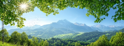  A picturesque scene of mountaineous ranges, dotted with forested foreground and sun-kissed peaks in the backdrop photo