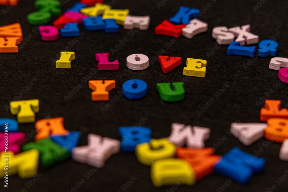 Obraz premium Multicolored wooden letters spelling