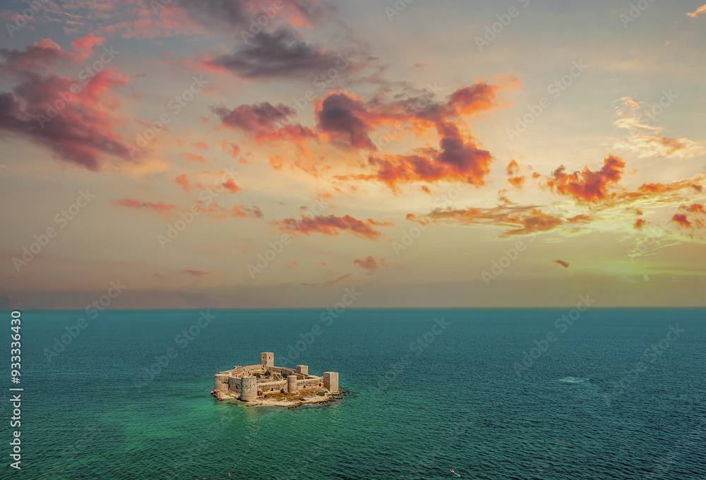 Kız Kalesi (Maiden Castle) on a cloudy sky and sea - Mersin, Türkiye.
