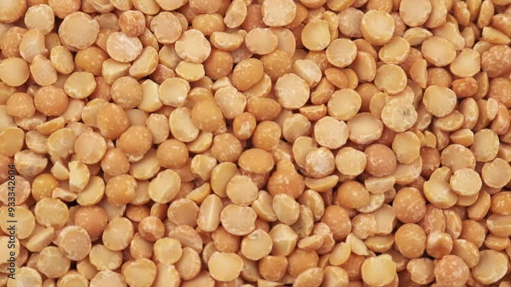 Top view of rotation dried yellow peas. Round yellow peas for cooking porridge, raw yellow peas scattered before cooking. Healthy food concept. Slow motion Top view of rotation dried yellow peas. Round yellow peas for cooking porridge, raw yellow peas scattered before cooking. Healthy food concept. Slow motion