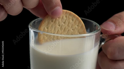 Wallpaper Mural Man's hands dip cookies into milk.
A glass of milk and cookies in the hands of a man Torontodigital.ca