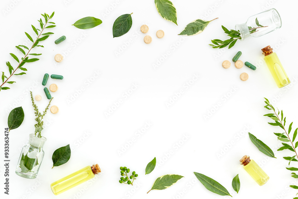 Healing fresh herbs and essential oil in glass bottles. Alternative herbal medicine concept Healing fresh herbs and essential oil in glass bottles. Alternative herbal medicine concept