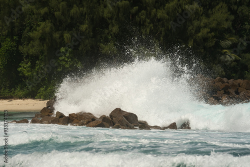 Big waves crushing on huge granite stones on Mahe island, Seychelles